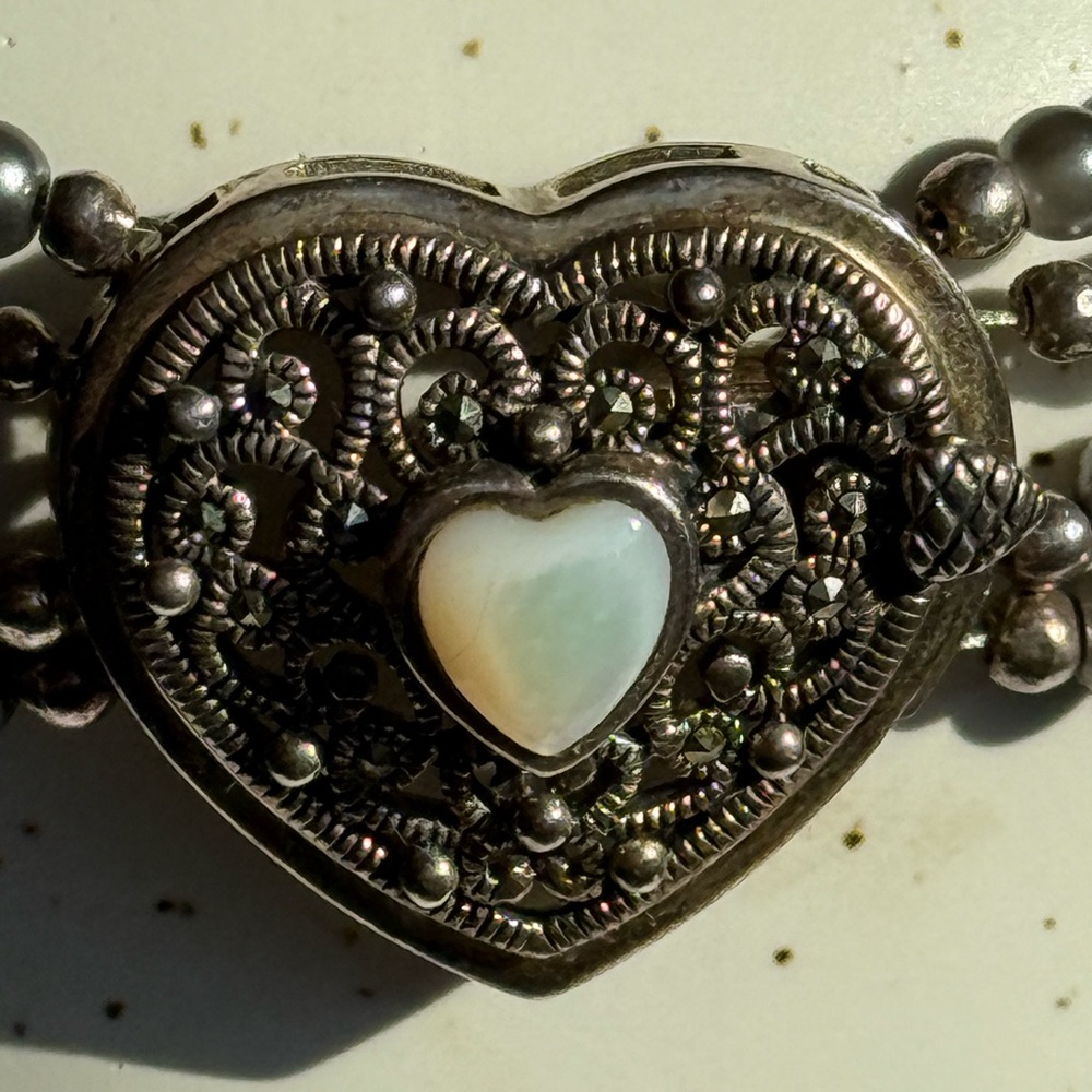 Intricate Silver Heart Bracelet with White Accent